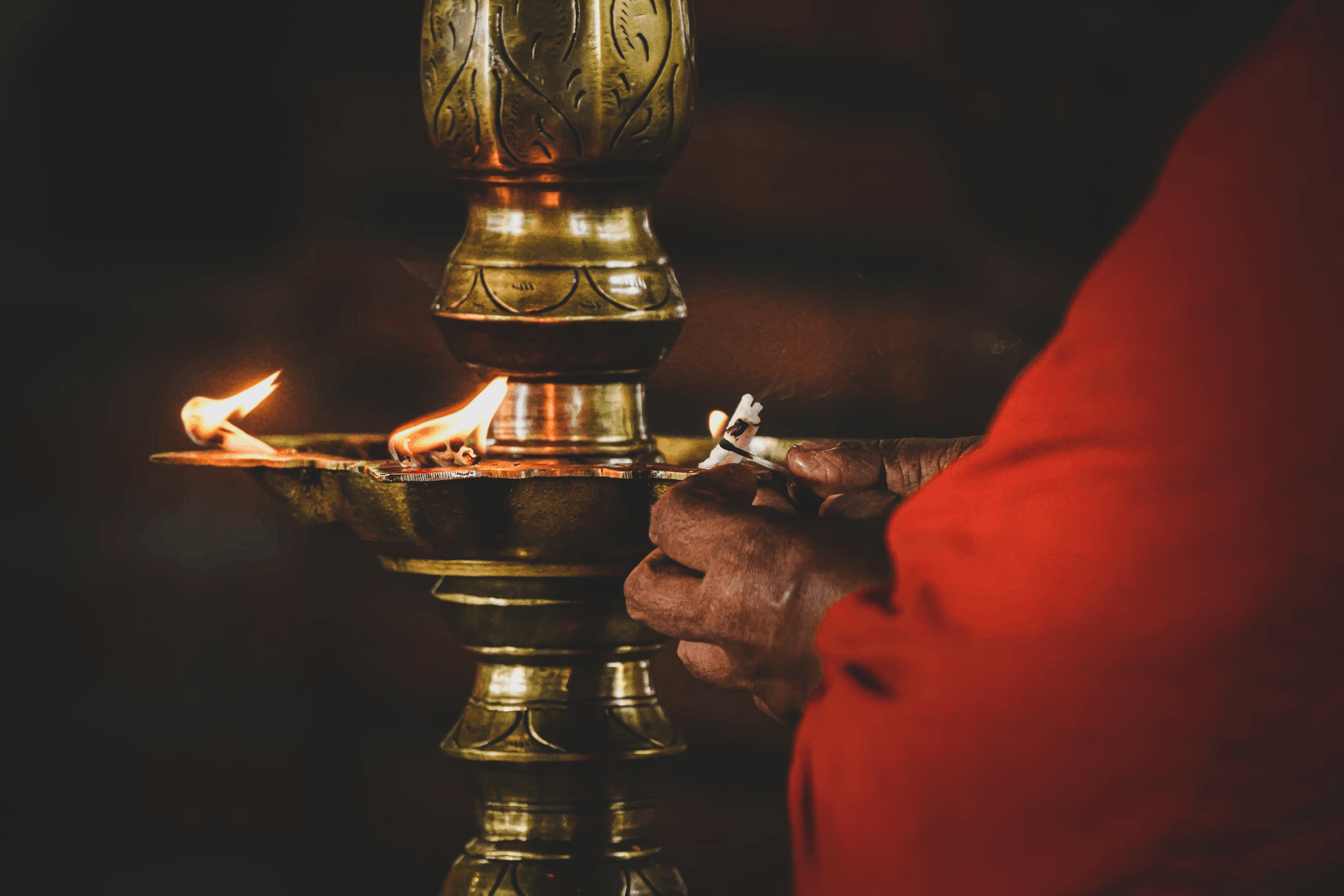 Traditional oil lamp being lit